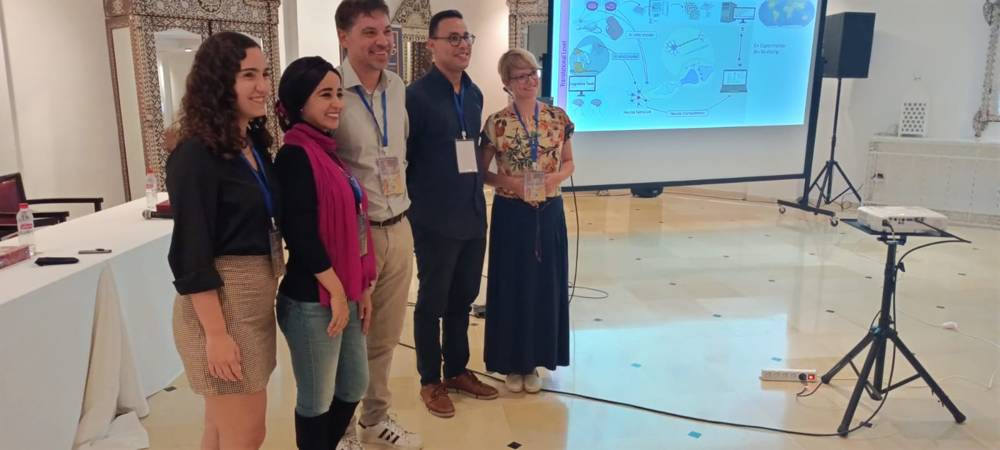 Closing the session — Speakers in front of the translational‑levels slide
