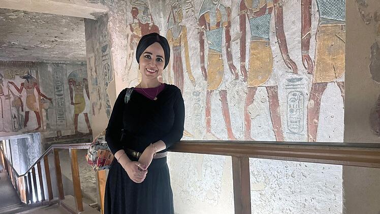 Dr. Radwa Khalil on location inside a painted tomb corridor during ARTE Television documentary filming