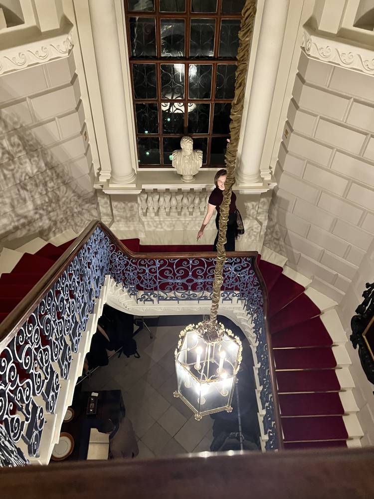 Evening reception — Historic staircase and chandelier